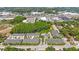Wonderful aerial view of the community including beautiful landscaping and a community pool at 789 Grand Cypress Ln, Tarpon Springs, FL 34689