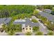 A stunning clubhouse is surrounded by lush landscaping that invites community gatherings and poolside relaxation at 789 Grand Cypress Ln, Tarpon Springs, FL 34689