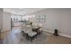 Elegant dining room with a wood table, upholstered chairs, pendant lighting, and modern decor at 789 Grand Cypress Ln, Tarpon Springs, FL 34689