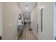 Inviting entryway featuring modern decor, a console table, and hardwood floors at 789 Grand Cypress Ln, Tarpon Springs, FL 34689
