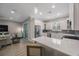 Bright, open kitchen featuring white cabinets, stainless steel appliances, and a breakfast bar at 789 Grand Cypress Ln, Tarpon Springs, FL 34689