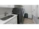 Laundry room features a large capacity washer/dryer unit and lots of storage space at 789 Grand Cypress Ln, Tarpon Springs, FL 34689