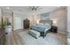 Bright main bedroom with ample closet space, furniture, and a comfortable bed at 789 Grand Cypress Ln, Tarpon Springs, FL 34689