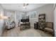 Home office with custom built-in shelving and plenty of natural light at 789 Grand Cypress Ln, Tarpon Springs, FL 34689