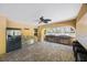 Outdoor kitchen complete with a grill, stone counter, sink, refrigerator and bar seating at 789 Grand Cypress Ln, Tarpon Springs, FL 34689