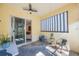 Covered patio with plenty of seating and natural light at 789 Grand Cypress Ln, Tarpon Springs, FL 34689