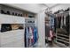 Well-organized walk-in closet with ample storage for clothes, shoes, and accessories at 789 Grand Cypress Ln, Tarpon Springs, FL 34689
