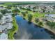 Beautiful aerial view of the community showcasing waterways, golf course, and residences at 815 Silverthorn Ln # 0, Sun City Center, FL 33573