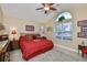 Inviting bedroom featuring a vaulted ceiling, ample natural light, and stylish decor, creating a cozy retreat at 815 Silverthorn Ln # 0, Sun City Center, FL 33573