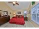 Comfortable bedroom showcasing neutral tones, hardwood floors, and a well-lit ambiance, ideal for relaxation and rest at 815 Silverthorn Ln # 0, Sun City Center, FL 33573