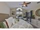 Spacious bedroom featuring a vaulted ceiling, work area, and access to the lanai, offering both comfort and convenience at 815 Silverthorn Ln # 0, Sun City Center, FL 33573