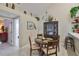 Charming dining area with hardwood floors, chandelier, and built in bar seating at 815 Silverthorn Ln # 0, Sun City Center, FL 33573