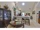 Bright dining area showcasing a chandelier and views of the kitchen with a breakfast bar at 815 Silverthorn Ln # 0, Sun City Center, FL 33573