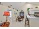 Cozy dining area adjacent to the kitchen, featuring a chandelier and display cabinet at 815 Silverthorn Ln # 0, Sun City Center, FL 33573