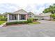 Charming home featuring a covered patio, meticulous landscaping, and a convenient two-car garage at 815 Silverthorn Ln # 0, Sun City Center, FL 33573