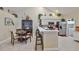 Open kitchen and dining area with stainless steel appliances and a breakfast bar at 815 Silverthorn Ln # 0, Sun City Center, FL 33573