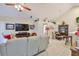 Spacious living room with tile floors, ceiling fan, television, and dining area at 815 Silverthorn Ln # 0, Sun City Center, FL 33573