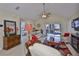 A bright living room is shown with patio access, neutral colors and tile floors at 815 Silverthorn Ln # 0, Sun City Center, FL 33573