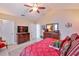 Bright main bedroom with a dresser, television, and stylish decor for a comfortable living space at 815 Silverthorn Ln # 0, Sun City Center, FL 33573