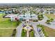 The community center and pool is surrounded by lovely homes in this aerial view at 8228 Sunlit Horizon Ln, Land O Lakes, FL 34637