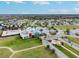 An elevated view of the community center pool area, the park and the surrounding homes at 8228 Sunlit Horizon Ln, Land O Lakes, FL 34637