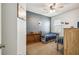 Bedroom features a unique brick-style accent wall, comfortable beds, and a bright, airy atmosphere at 8228 Sunlit Horizon Ln, Land O Lakes, FL 34637