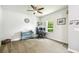 Spacious bedroom featuring a ceiling fan, neutral paint, and a dedicated workspace with lots of natural light at 8228 Sunlit Horizon Ln, Land O Lakes, FL 34637