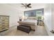 Relaxing bedroom featuring a tufted headboard bed, soft carpet, and neutral colors to promote relaxation at 8228 Sunlit Horizon Ln, Land O Lakes, FL 34637