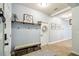 Welcoming entryway with a bench, decor, and neutral color scheme at 8228 Sunlit Horizon Ln, Land O Lakes, FL 34637