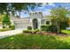 Charming single-story home with a well-manicured lawn and inviting curb appeal at 8228 Sunlit Horizon Ln, Land O Lakes, FL 34637
