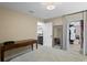 Bright bedroom featuring a modern table, mirror, and closet space, offering comfort and functionality at 8407 Granite Pl, Tampa, FL 33615