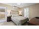 Cozy bedroom with neutral tones, featuring a comfortable bed and side tables at 8407 Granite Pl, Tampa, FL 33615