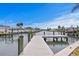 Scenic view of a private dock extending into the calm waterways, perfect for boating and relaxation at 8407 Granite Pl, Tampa, FL 33615