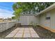 Unique front yard featuring a decorative concrete block wall, modern landscaping, and a cozy entrance at 8407 Granite Pl, Tampa, FL 33615