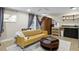 Living area featuring sofa, armoire, kitchenette, and wooden table and chairs at 8407 Granite Pl, Tampa, FL 33615