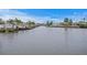 Picturesque waterfront view featuring docks, boats, and beautiful homes along the serene water at 8407 Granite Pl, Tampa, FL 33615