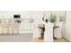 Bright dining area features a wooden table, white chairs, and modern decor, located adjacent to the kitchen at 8449 Sea Ray Run, Parrish, FL 34219