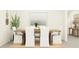 Dining room with wood table, white chairs, area rug, neutral color scheme and decor at 8449 Sea Ray Run, Parrish, FL 34219