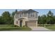 Two-story home featuring a two-car garage, neutral color palette, landscaping and manicured lawn at 8449 Sea Ray Run, Parrish, FL 34219