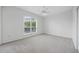 Bright bedroom with a large window overlooking outdoors at 10232 Estuary Dr, Tampa, FL 33647