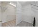 Large walk-in closet with adjustable white shelving, offering ample storage at 10232 Estuary Dr, Tampa, FL 33647