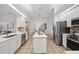 Bright, open kitchen with island, stainless appliances, and ample counter space for cooking at 10232 Estuary Dr, Tampa, FL 33647