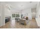Comfortable living room with fireplace, tile flooring, and large windows overlooking the backyard at 10232 Estuary Dr, Tampa, FL 33647