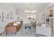 Open concept living room featuring modern decor and seamless flow into the dining and kitchen areas at 10232 Estuary Dr, Tampa, FL 33647