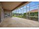 Spacious screened patio overlooking a serene lake and lush greenery at 10232 Estuary Dr, Tampa, FL 33647