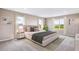 Spacious bedroom featuring natural light, a plush carpet, and stylish modern décor at 10669 Bridgegate Heights Loop, San Antonio, FL 33576
