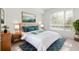 Stylishly decorated bedroom featuring a plush bed, area rug, and a large window with natural light at 111 N 12Th St # 1305, Tampa, FL 33602