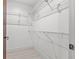 Walk-in closet with white shelving at 111 N 12Th St # 1305, Tampa, FL 33602
