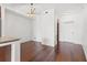Modern dining area with hardwood floors and stylish light fixture near kitchen area at 111 N 12Th St # 1305, Tampa, FL 33602