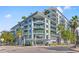 Beautiful condominium building with lush tropical landscaping and outdoor seating near the entrance at 111 N 12Th St # 1305, Tampa, FL 33602